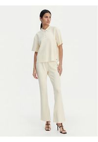 Calvin Klein Spodnie materiałowe LV044B223G Beżowy Flare Fit. Kolor: beżowy. Materiał: syntetyk #2