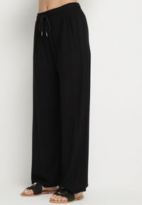 Born2be - Czarne Spodnie Bawełniane Szerokie z Gumką w Pasie Efranica. Okazja: na co dzień. Kolor: czarny. Materiał: bawełna. Styl: elegancki, casual