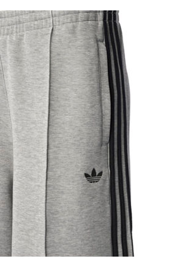 Adidas - adidas Spodnie dresowe adicolor Spacer 3-Stripes JV7497 Zielony Wide Leg. Kolor: zielony. Materiał: bawełna. Sport: turystyka piesza