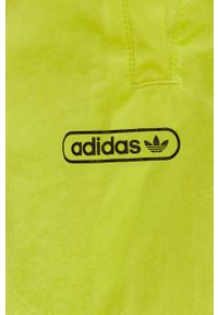 adidas Originals Spodnie dwustronne męskie kolor żółty gładkie. Kolor: żółty. Materiał: poliester. Wzór: gładki #2