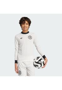 Adidas - Koszulka Germany Anniversary Long Sleeve Kids. Kolor: czarny, biały, wielokolorowy. Materiał: materiał. Długość rękawa: długi rękaw. Sport: piłka nożna