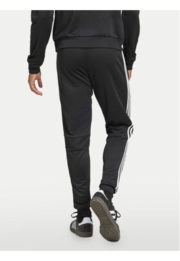 Adidas - adidas Spodnie dresowe Tiro 25 Essentials Sweat JC5464 Czarny Regular Fit. Kolor: czarny. Materiał: syntetyk