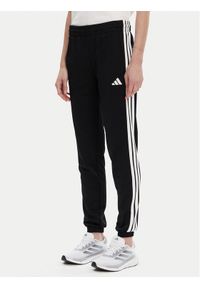 Adidas - adidas Spodnie dresowe Tricot 3-Stripes JF3383 Czarny Regular Fit. Kolor: czarny. Materiał: syntetyk #1