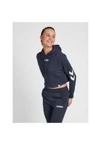 Damska bluza z kapturem crop top Hummel hmlLEGACY. Typ kołnierza: kaptur. Kolor: zielony, niebieski, wielokolorowy. Materiał: bawełna, tkanina. Wzór: nadruk. Sport: fitness