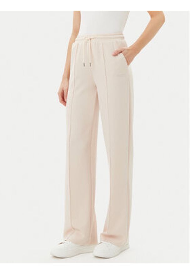 Guess Spodnie dresowe V5RB19 KCOB2 Beżowy Regular Fit. Kolor: beżowy. Materiał: syntetyk