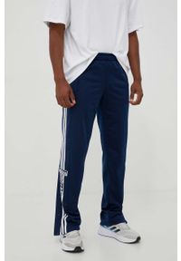 adidas Originals spodnie dresowe kolor granatowy z aplikacją. Kolor: niebieski. Materiał: dresówka. Wzór: aplikacja #1