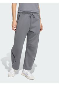 Adidas - adidas Spodnie materiałowe Z.N.E. OPEN HEMZ.N.E. OPEN HEM Szary Loose Fit. Kolor: szary. Materiał: materiał #1
