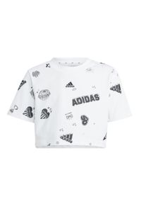 Adidas - Koszulka Brand Love Allover Print Crop Kids. Kolor: biały, czarny, wielokolorowy. Materiał: dresówka. Wzór: nadruk