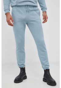 GAP Spodnie męskie gładkie. Kolor: niebieski. Materiał: dzianina, poliester. Wzór: gładki