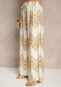 Renee - Beżowe Spodnie z Wiskozy o Szerokim Kroju High Waist ze Wzorem Boho Neolissea. Okazja: na co dzień, na spacer. Stan: podwyższony. Kolor: beżowy. Materiał: wiskoza. Sezon: lato. Styl: boho #4