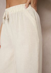 Renee - Jasnobeżowe Spodnie o Szerokim Kroju High Waist Edilisea. Okazja: do pracy, na spotkanie biznesowe, na co dzień. Stan: podwyższony. Kolor: beżowy. Styl: casual, elegancki, biznesowy