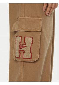 Tommy Jeans Spodnie materiałowe DW0DW20531 Beżowy Relaxed Fit. Kolor: beżowy. Materiał: bawełna