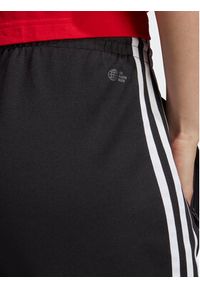 Adidas - adidas Spodnie dresowe adicolor IB5916 Czarny Slim Fit. Kolor: czarny. Materiał: dresówka, syntetyk