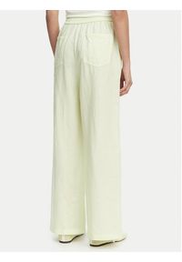 Tommy Jeans Spodnie materiałowe DW0DW22285 Zielony jasny Loose Fit. Kolor: zielony. Materiał: len #2