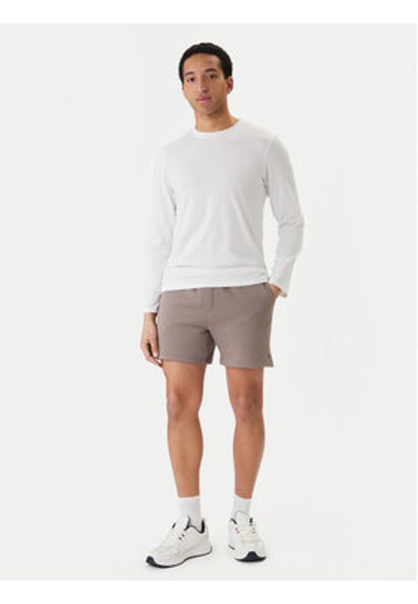 Tommy Jeans Szorty sportowe DM0DM21931 Beżowy Regular Fit. Kolor: beżowy. Materiał: bawełna. Styl: sportowy