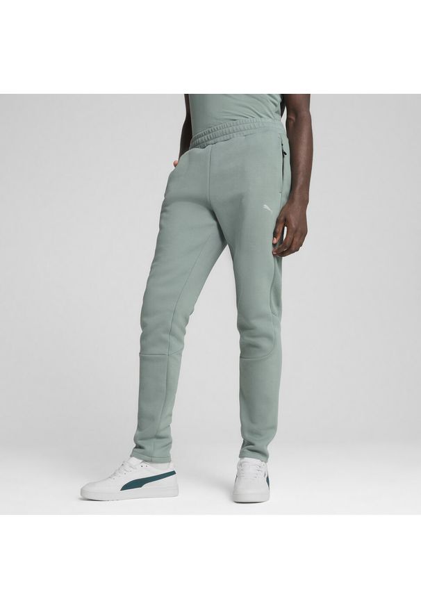Puma - Męskie spodnie EVOSTRIPE PUMA Green Moon. Kolor: zielony. Materiał: dresówka. Sport: piłka nożna