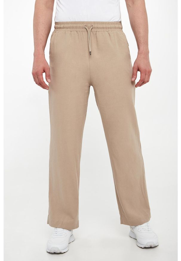 Emporio Armani Swimwear - Spodnie męskie z lnem EMPORIO ARMANI SWIMWEAR. Materiał: len