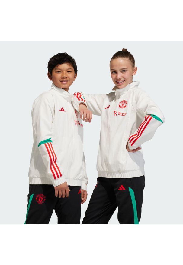 Adidas - Manchester United Tiro 23 Presentation Jacket Kids. Kolor: biały. Materiał: materiał