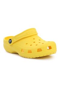 Klapki Crocs Classic Kids Clog 206991-7C1 żółte. Okazja: na plażę, na co dzień. Kolor: żółty. Materiał: syntetyk. Styl: klasyczny, wakacyjny, casual