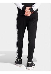 Adidas - adidas Spodnie dresowe adicolor Classics SST IL2488 Czarny Slim Fit. Kolor: czarny. Materiał: bawełna