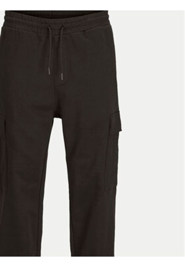 Jack & Jones - Jack&Jones Spodnie dresowe Kane 12263074 Czarny Relaxed Fit. Kolor: czarny. Materiał: bawełna
