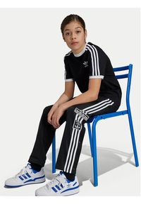 Adidas - adidas Spodnie dresowe Adibreak IY9773 Czarny Regular Fit. Kolor: czarny. Materiał: syntetyk