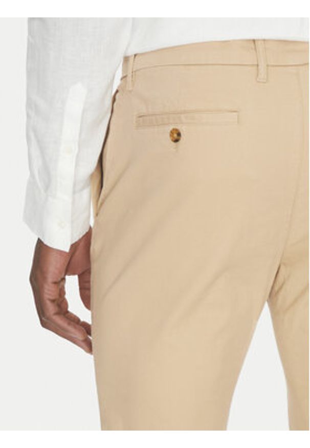 Michael Kors Chinosy CS4301KDR2 Beżowy Slim Fit. Kolor: beżowy. Materiał: bawełna