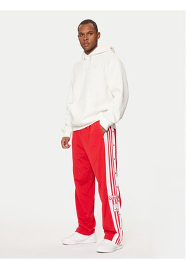 Adidas - adidas Spodnie dresowe Adibreak JP3765 Czerwony Regular Fit. Kolor: czerwony. Materiał: syntetyk