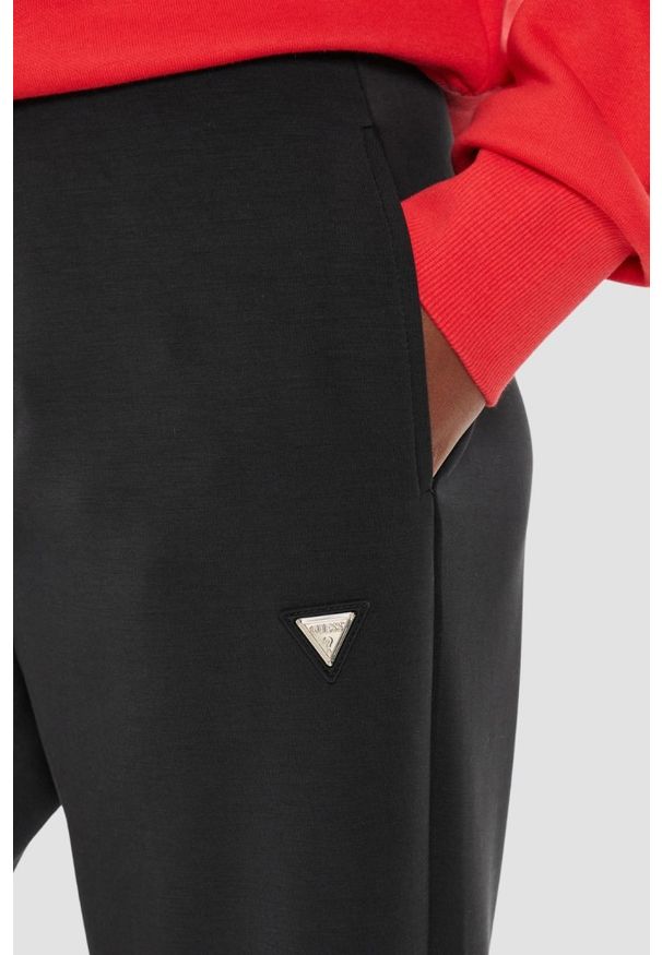 Guess - GUESS Czarne damskie spodnie dresowe Olympe, Rozmiar L. Kolor: czarny. Materiał: dresówka