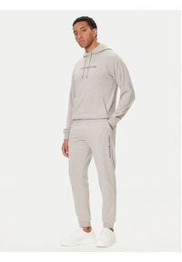 TOMMY HILFIGER - Tommy Hilfiger Spodnie dresowe UM0UM03664 Beżowy Regular Fit. Kolor: beżowy. Materiał: syntetyk, bawełna #4