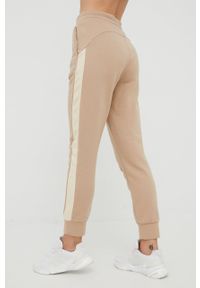 4f - 4F spodnie dresowe damskie kolor beżowy gładkie. Kolor: beżowy. Materiał: dresówka. Wzór: gładki