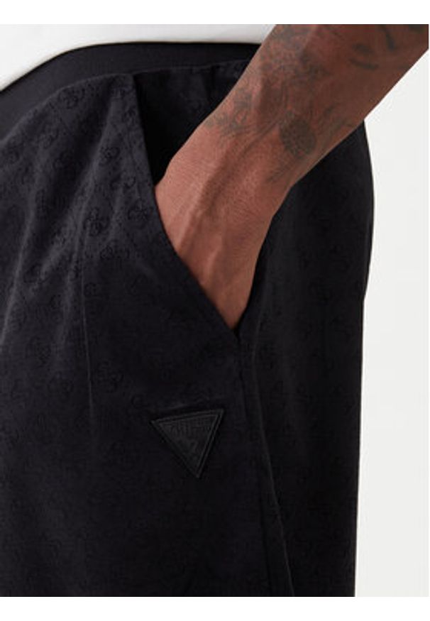 Guess Spodnie dresowe Z6RB14 KD612 Czarny Regular Fit. Kolor: czarny. Materiał: syntetyk