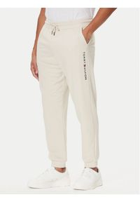 TOMMY HILFIGER - Tommy Hilfiger Spodnie dresowe UM0UM03664 Écru Regular Fit. Materiał: bawełna