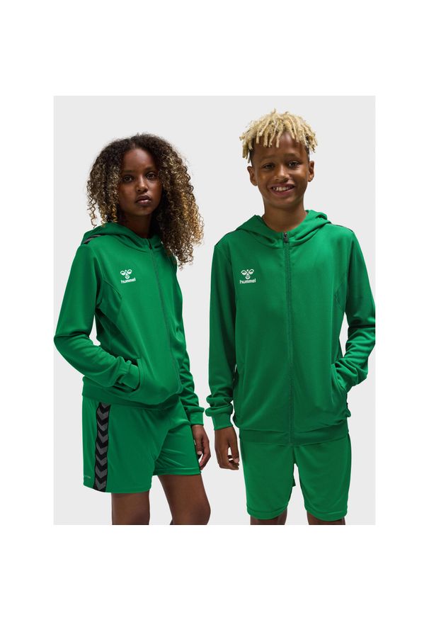 Dziecięca poliestrowa kurtka dresowa z kapturem i zamkiem błyskawicznym Hummel A. Typ kołnierza: kaptur. Kolor: zielony. Materiał: dresówka, poliester. Sport: joga i pilates