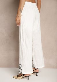Renee - Biało-Czarne Spodnie z Bawełny o Szerokim Kroju High Waist Ozdobione Haftem Fenoriela. Okazja: na co dzień. Stan: podwyższony. Kolor: biały. Materiał: bawełna. Wzór: haft, aplikacja. Styl: casual, boho, elegancki