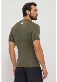 Under Armour t-shirt treningowy kolor zielony gładki. Kolor: zielony. Materiał: skóra, materiał. Długość rękawa: raglanowy rękaw. Wzór: gładki #2