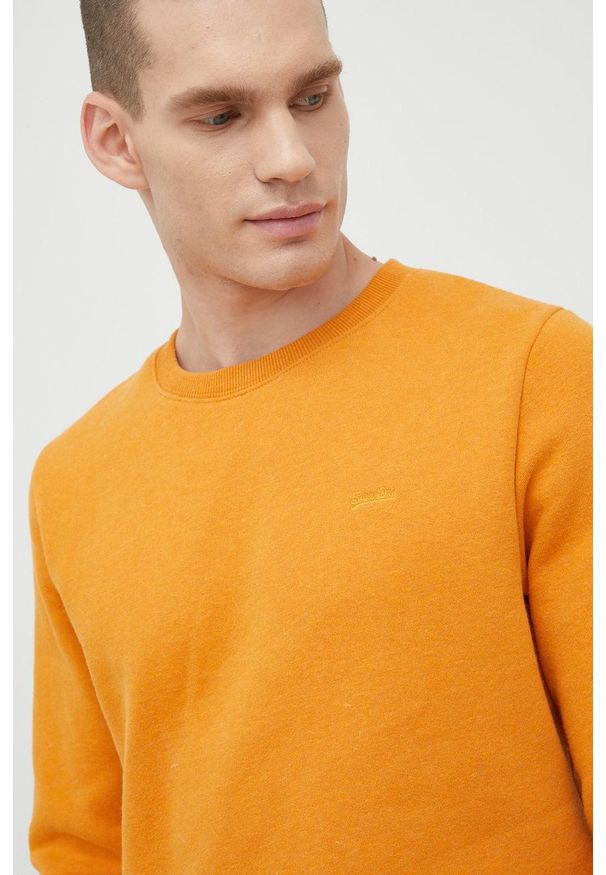 Superdry bluza męska kolor pomarańczowy z aplikacją. Kolor: pomarańczowy. Materiał: bawełna, dzianina, materiał. Wzór: aplikacja