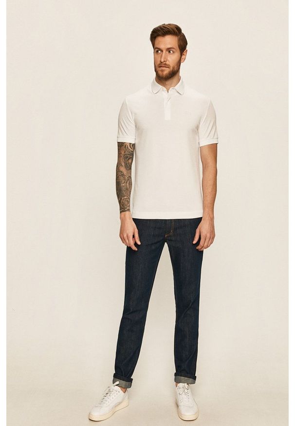 Lacoste - Polo. Okazja: na co dzień. Typ kołnierza: polo. Kolor: biały. Materiał: dzianina. Długość: krótkie. Styl: casual