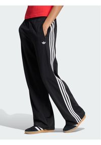 Adidas - adidas Spodnie dresowe Pinstripe Firebird KS6787 Czarny Loose Fit. Kolor: czarny. Materiał: syntetyk #1