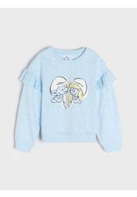Sinsay - Bluza The Smurfs - niebieski. Typ kołnierza: kołnierz z falbankami. Kolor: niebieski. Długość rękawa: długi rękaw. Długość: długie. Wzór: aplikacja, ażurowy, nadruk, kwiaty