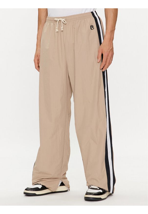 Champion Spodnie dresowe 220008 Beżowy Custom Fit. Kolor: beżowy. Materiał: syntetyk