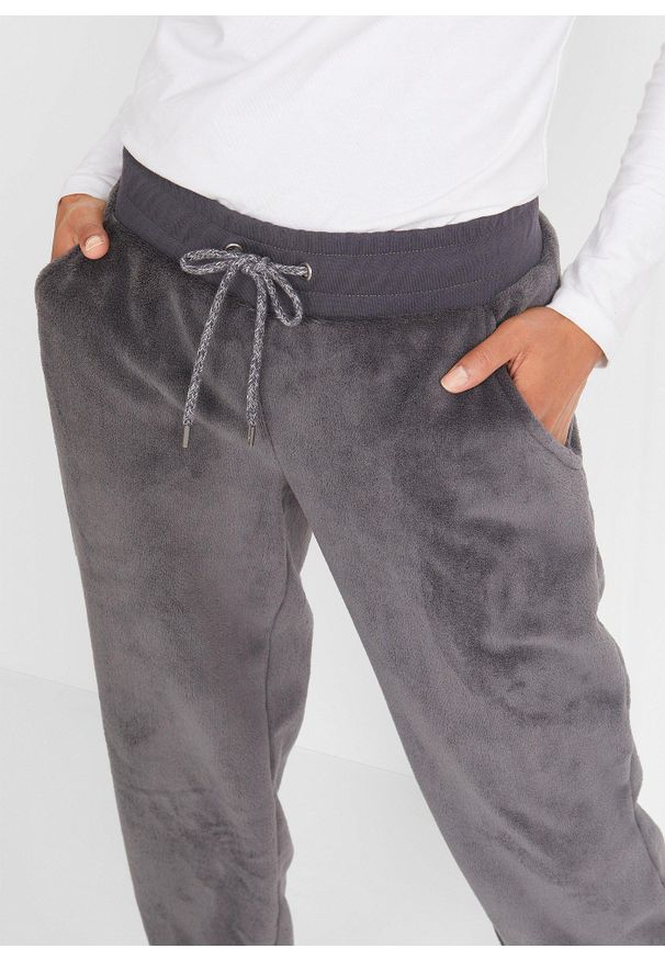 bonprix - Spodnie dresowe z elastyczną gumką w talii. Kolor: szary. Materiał: polar, dresówka. Styl: sportowy