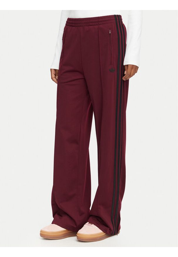 Adidas - adidas Spodnie dresowe Firebird Loose Tracksuit KS4669 Bordowy Loose Fit. Kolor: czerwony. Materiał: syntetyk