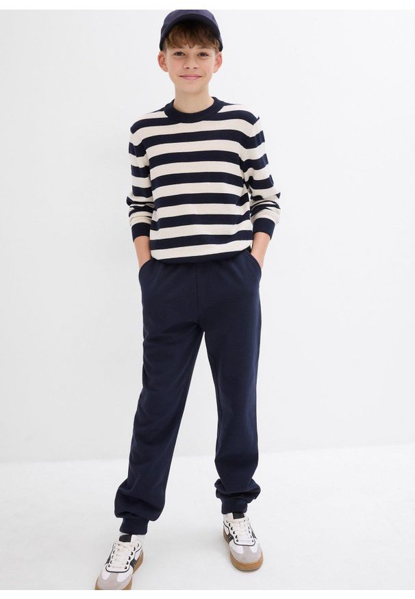 bonprix - Spodnie sportowe z miękkiej mieszanki z bawełny. Kolor: niebieski. Materiał: bawełna. Styl: sportowy