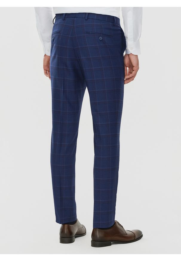 Pako Lorente - PAKO LORENTE – Granatowe spodnie garniturowe w czerwono-niebieską kratkę. Kolor: czerwony, niebieski, wielokolorowy. Materiał: poliester, wełna, lycra. Wzór: kratka