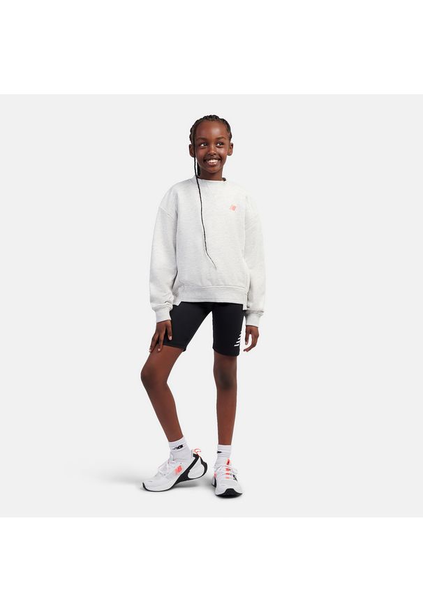 Bluza dziecięca New Balance LAKG0205AHH – szara. Kolor: szary. Materiał: poliester, bawełna. Wzór: napisy. Styl: sportowy