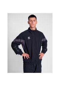 Kurtka z dresu Hummel Travel. Kolor: czarny. Materiał: dresówka. Sport: piłka nożna #1