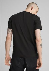 Puma - Męska koszulka z grafiką PUMATECH PUMA Black. Kolor: czarny. Materiał: guma. Wzór: nadruk, kolorowy