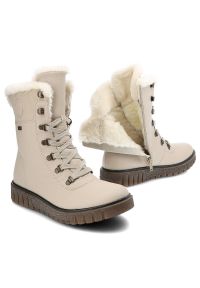 Botki damskie Rieker, cholewka z gładkiej skóry naturalnej z wysoką cholewką i sznurowaniem oraz miękkim obszyciem przy krawędzi gruba podeszwa z wyr. Wysokość cholewki: przed kolano. Kolor: beżowy. Materiał: futro, syntetyk, skóra ekologiczna. Szerokość cholewki: normalna. Wzór: gładki. Obcas: na platformie #3