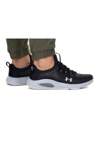 Buty do chodzenia męskie Under Armour Hovr Rise 4. Zapięcie: sznurówki. Kolor: wielokolorowy, czarny, szary. Materiał: guma, materiał, syntetyk. Szerokość cholewki: normalna. Sport: turystyka piesza